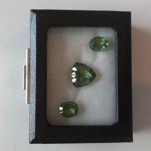 Three Emerald Envy Topaz Gemstones.